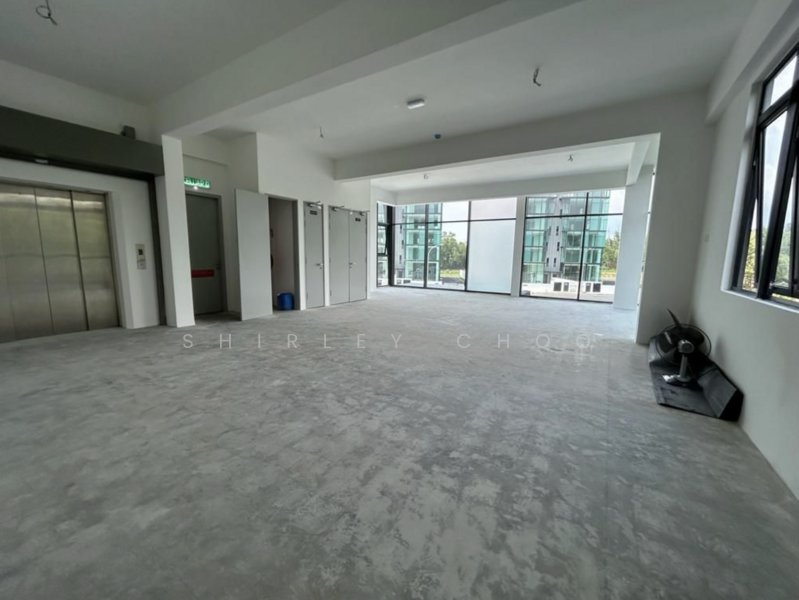 Open floor space with lift access and glass frontage, photo 3 of 5