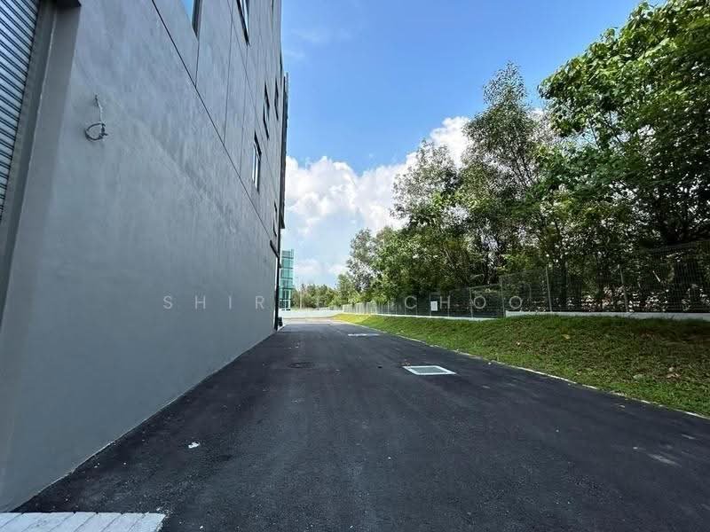 External tarred access road alongside the building, photo 8 of 8